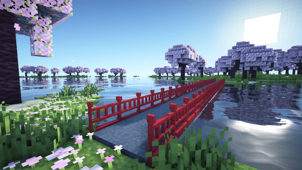 Minecraft image containing sakura trees, a body of water and a feudal Japan style bridge connecting two islands